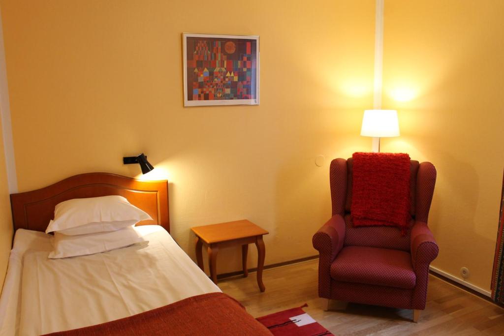 Postel nebo postele na pokoji v ubytování Teaterhotellet