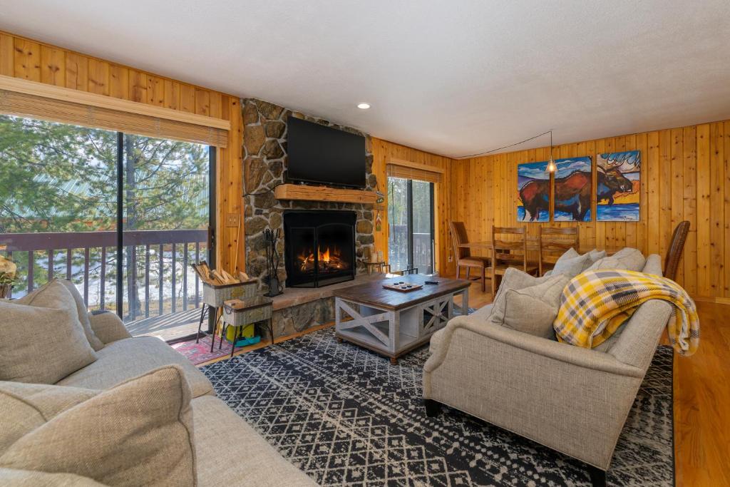 a living room with a couch and a fireplace at 1126 Western Road in Grand Lake