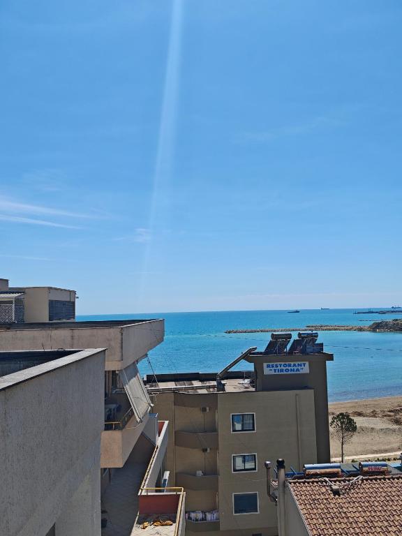 a view of the ocean from the balcony of a building at Sea View Family Apartment Durres in Durrës