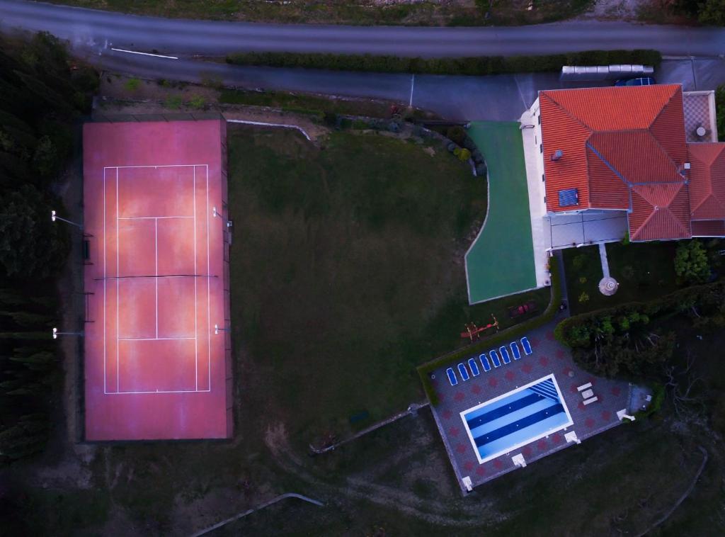 an overhead view of a house and a swimming pool at Villa Nature Retreat in Gruda