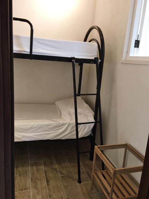 Posteľ alebo postele v izbe v ubytovaní Casa Vacanza Piazza Gramsci 1