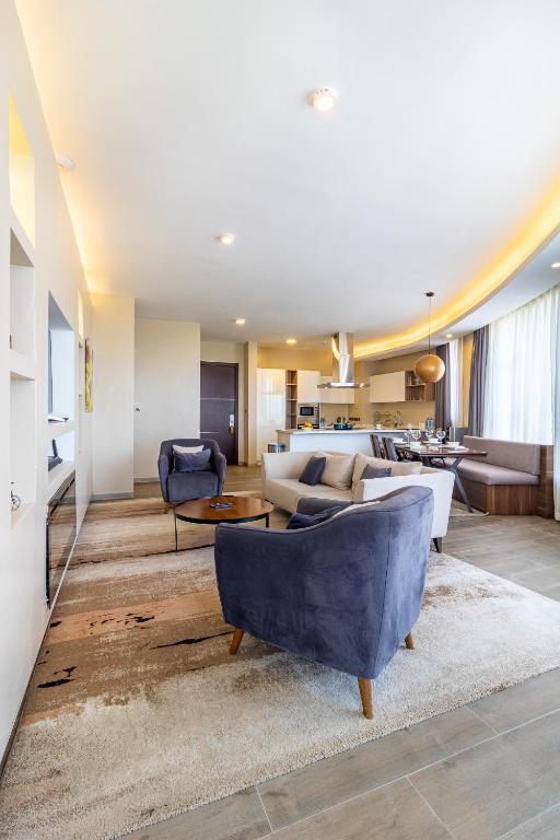 a living room with a couch and a table at A Scenic Escape within Nairobi in Nairobi