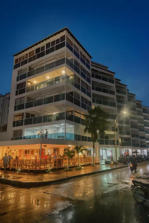 a large office building with a lot of windows at Coral Confort APTS San Andres in San Andrés