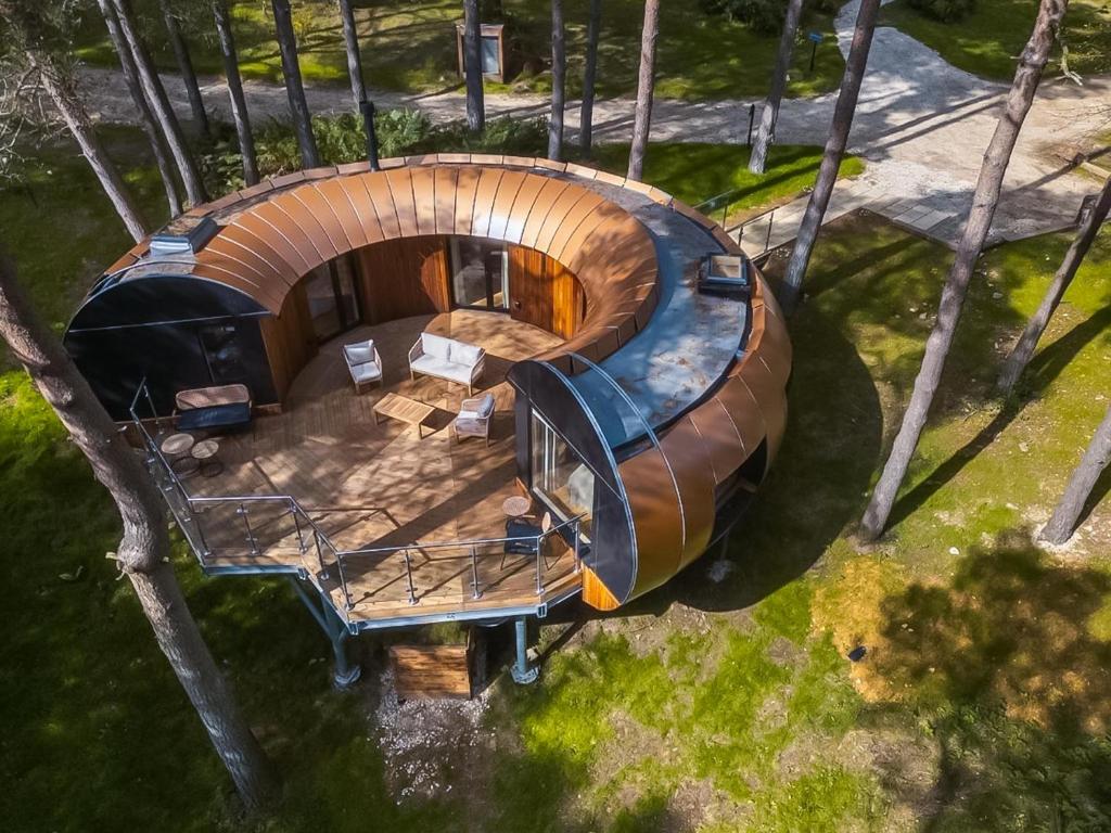 an overhead view of a circular house with a table in a yard at Liberty-Qu7629 in Chipping Norton