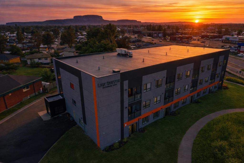 an aerial view of a building at sunset at Lux Suites Extended Stay in Thunder Bay