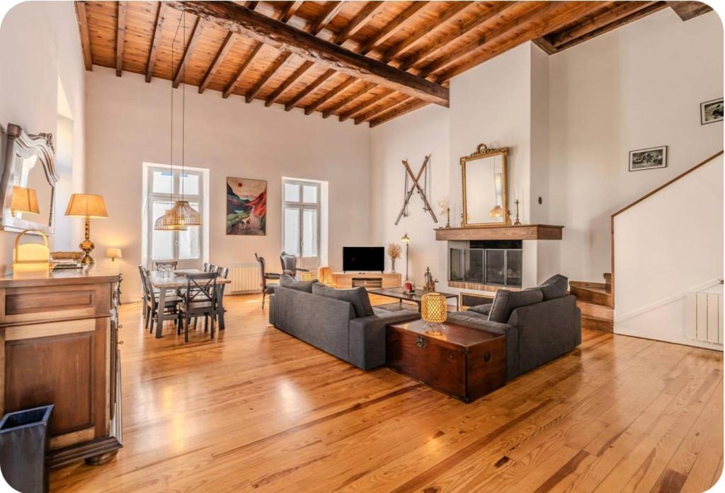 a living room with a couch and a table at Villa Marisa in Ax-les-Thermes