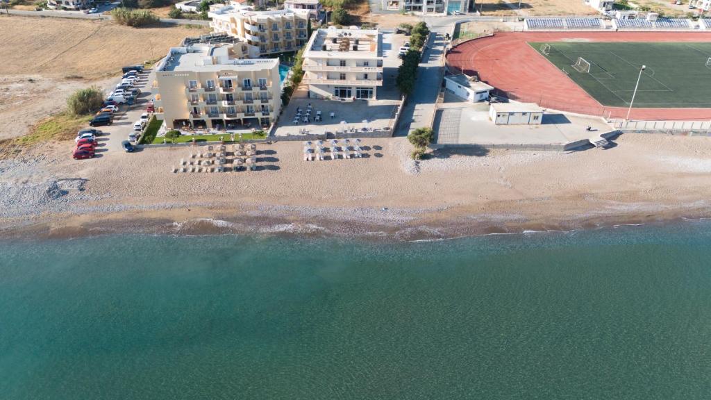 an aerial view of a beach with buildings and the water at Galini Beach Hotel in Kissamos