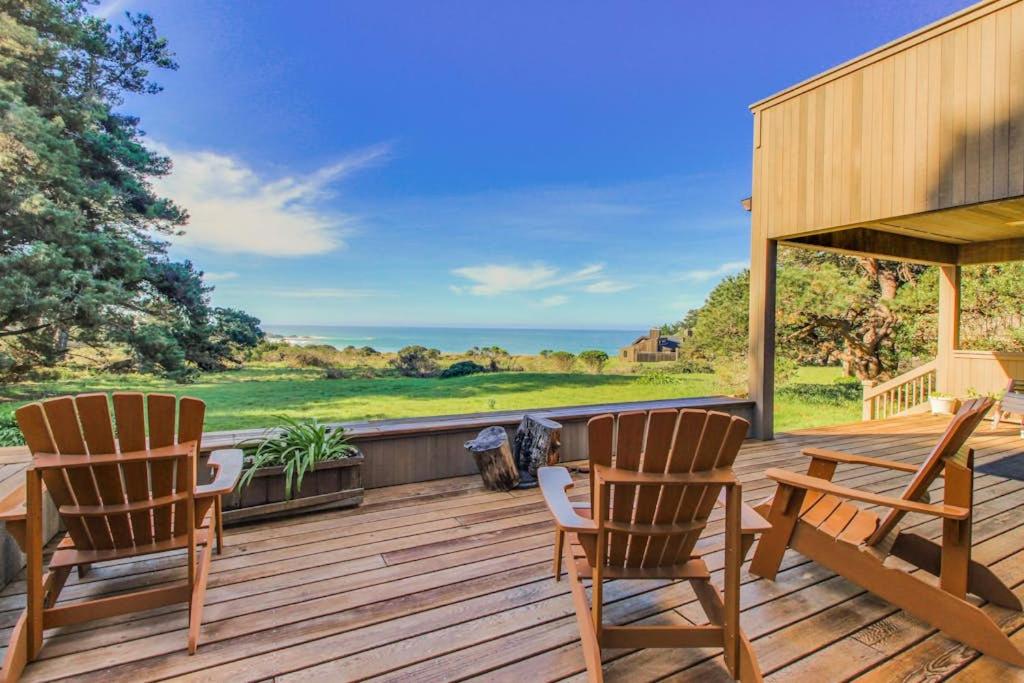 two chairs and a table on a wooden deck at Webb House in Valley Crossing