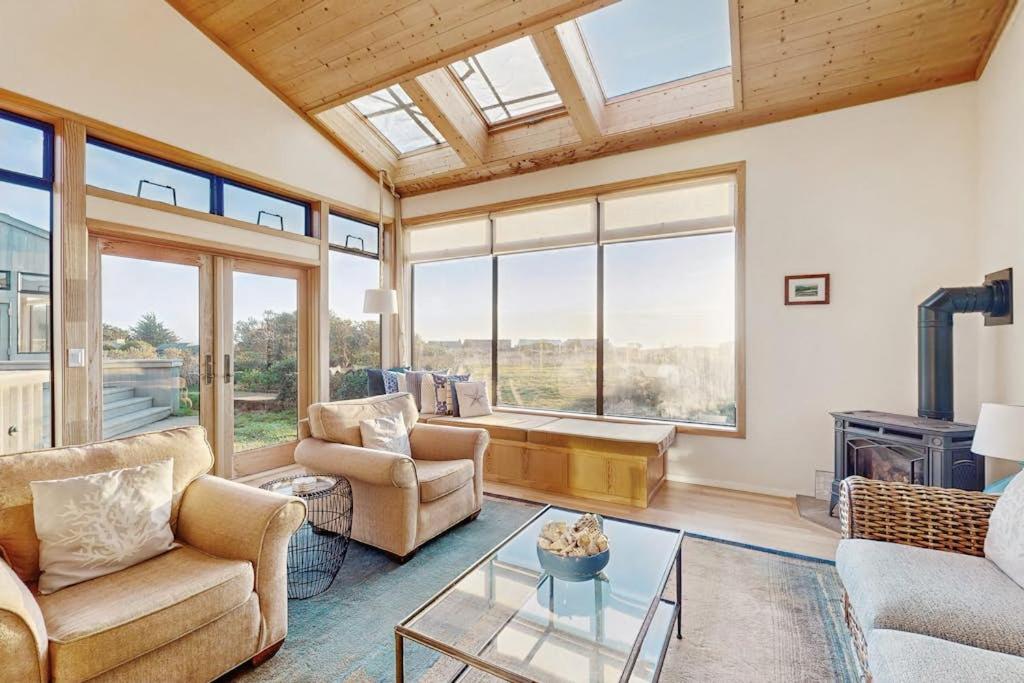 a living room with a couch and a table at Del Mar Meadow in Sea Ranch