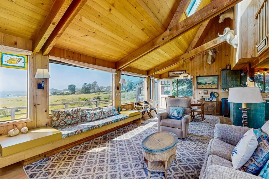 a living room with a couch and a table at Thayer House in Sea Ranch