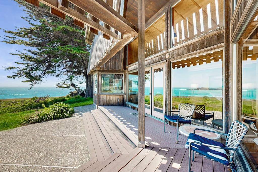 a porch of a house with a view of the ocean at Curtis-Moulton Retreat in Sea Ranch