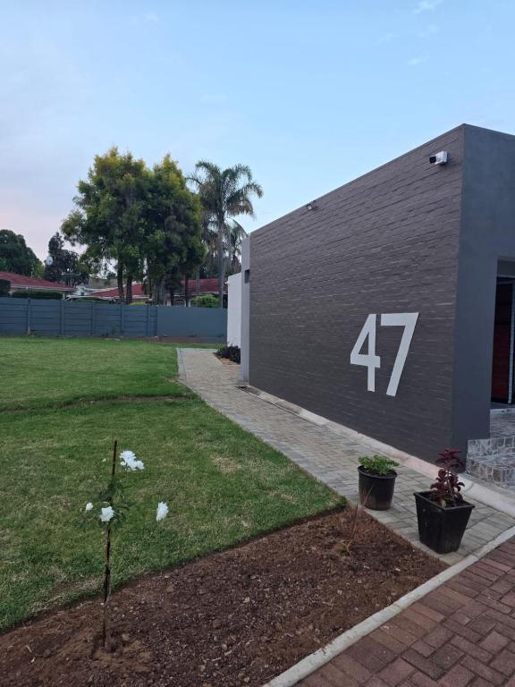 a building with the number on the side of it at 47 Northward BnB in Newcastle