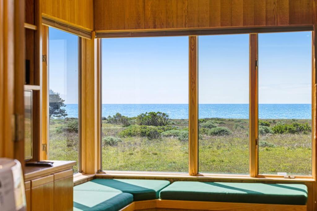 a room with a window with a view of the ocean at Toto House in Gualala