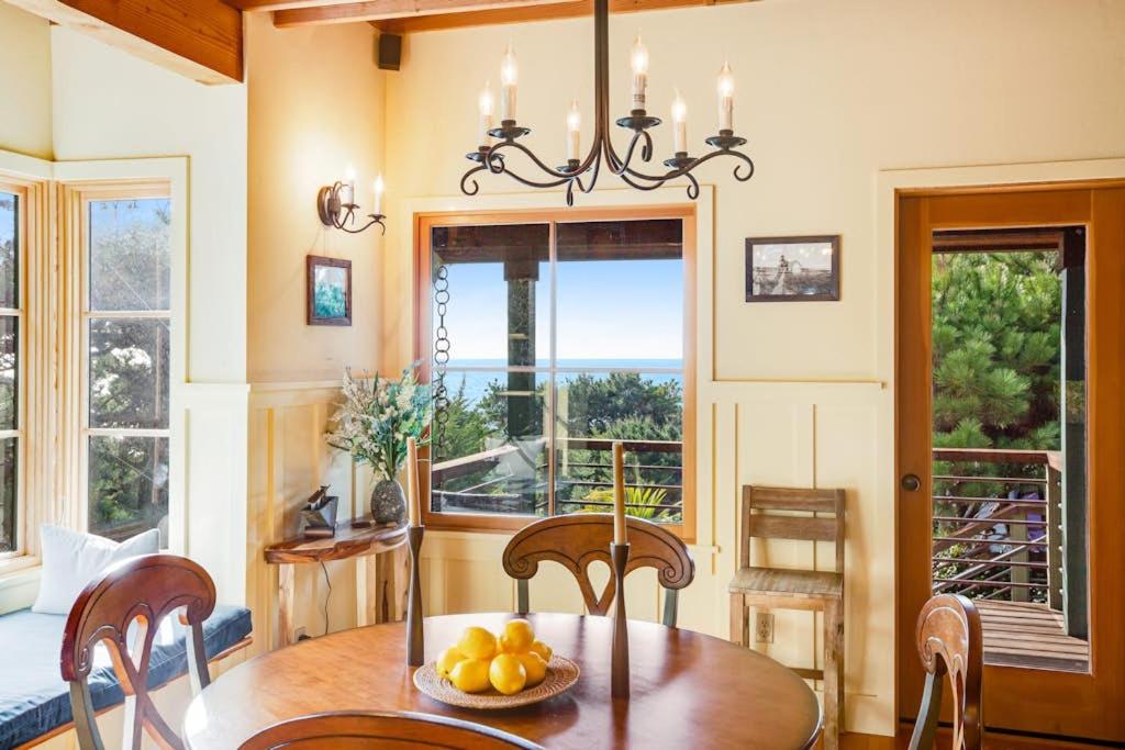 a dining room with a table with a bowl of fruit at Shangri-lala in Gualala