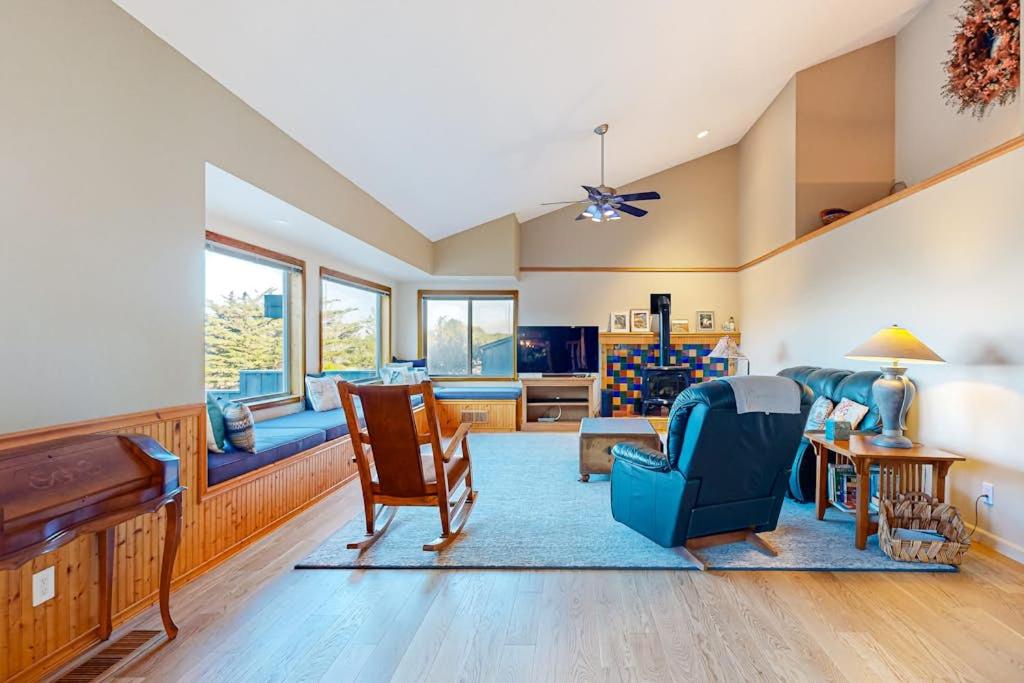a living room with chairs and a table at Eternal Equinox in Sea Ranch