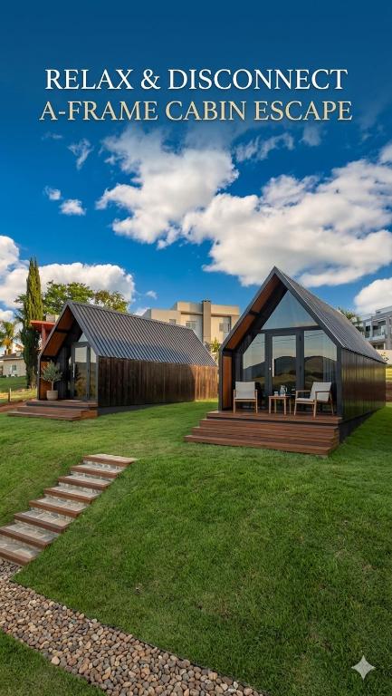 a picture of a frame cabin in a park at Chalés da colina em Victor Graeff in Cochinho
