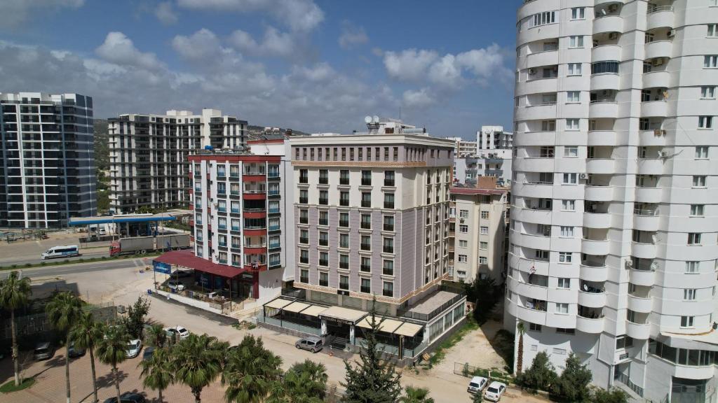 an aerial view of a city with tall buildings at Minerva Hotel Kızkalesi in Kizkalesi