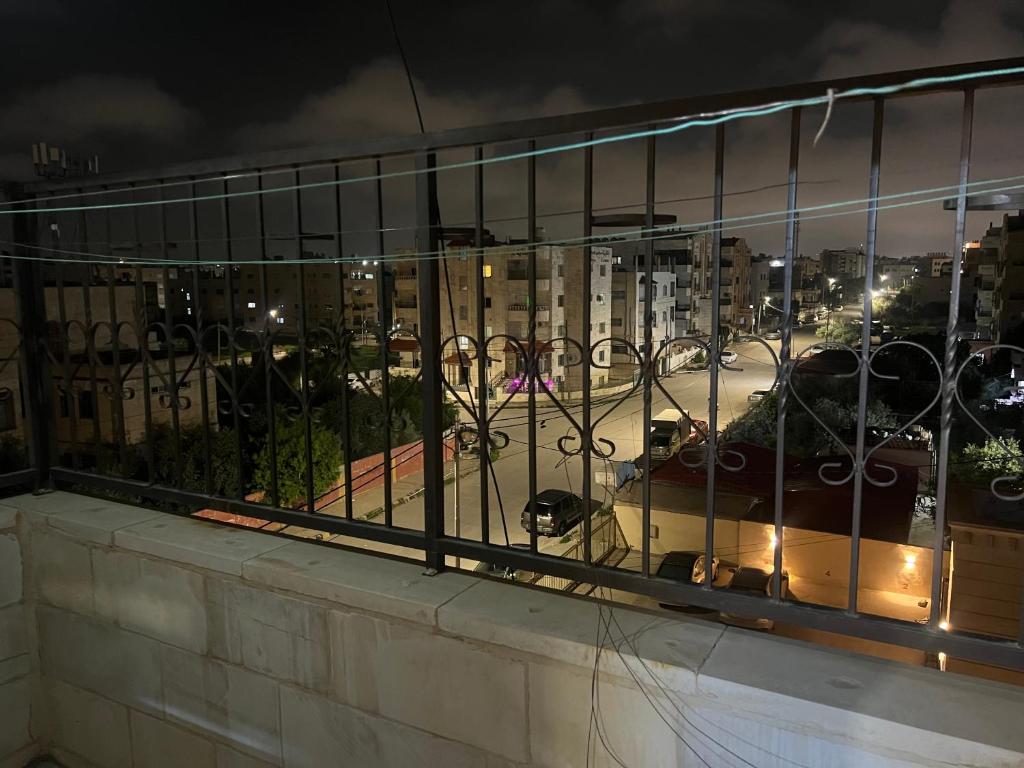 a view of a city from a window at night at اربد الحي الشرقي in Irbid
