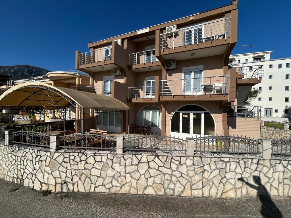 a person standing in front of a building at Villa Cherry in Bar