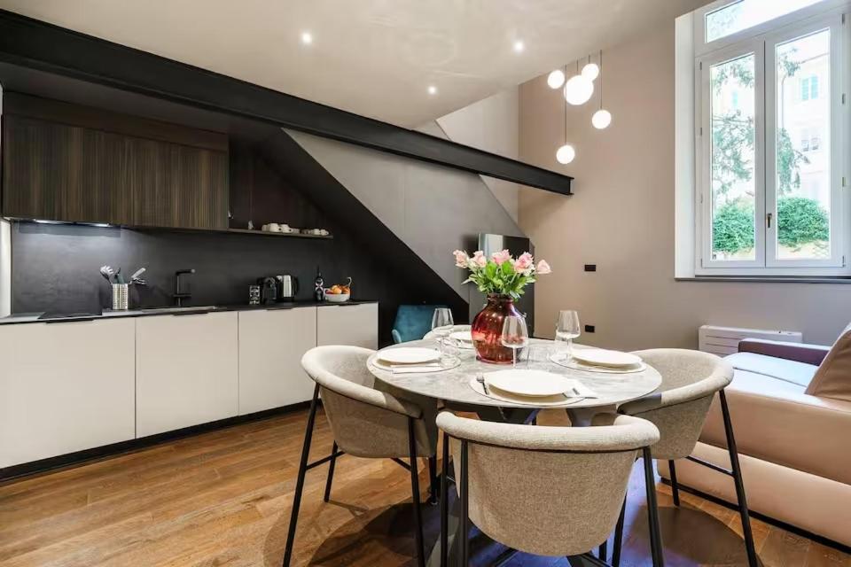 a kitchen and dining room with a table and chairs at Palazzo Venezia in Florence