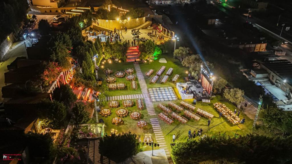 an aerial view of a garden at night at Lunasol venue in Ar Rumayl