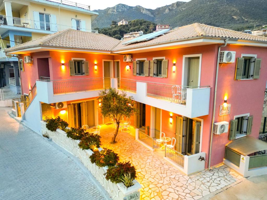 an image of a house with a courtyard at ANAX APARTMENTS PARGA in Parga