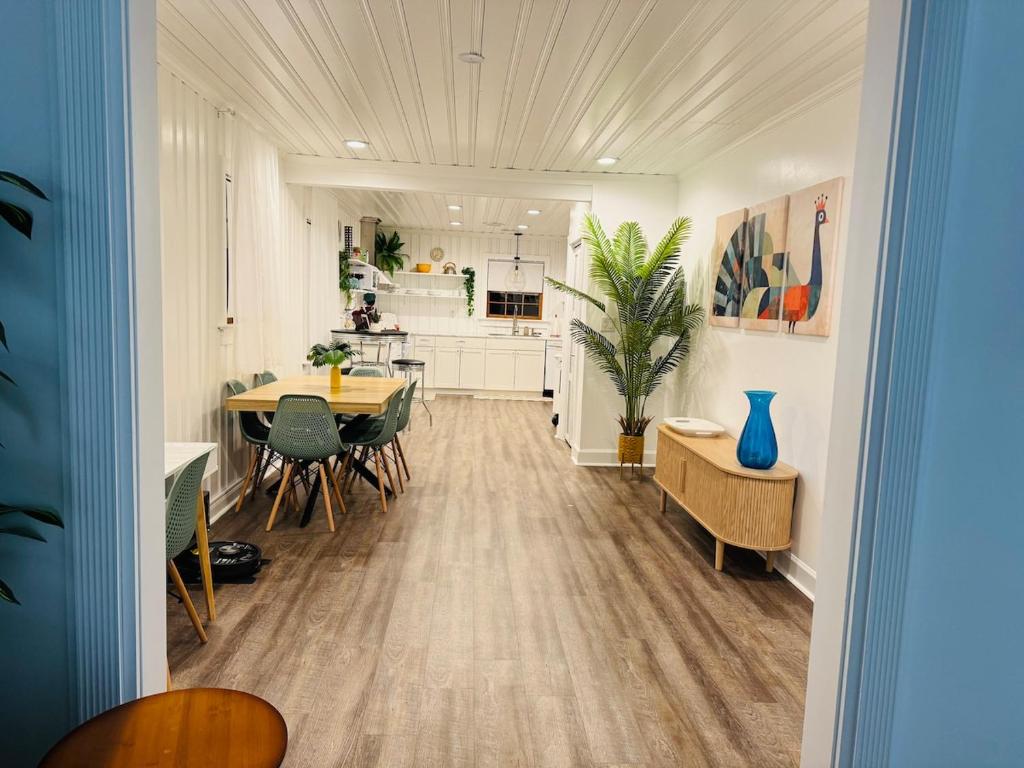 a kitchen and dining room with a table and chairs at Retro Retreat in Wilson