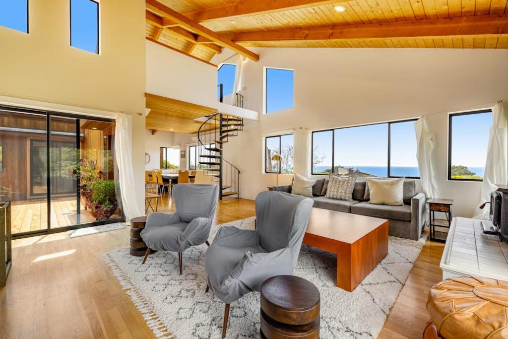 a living room with a table and chairs at SeaRenity in Sea Ranch