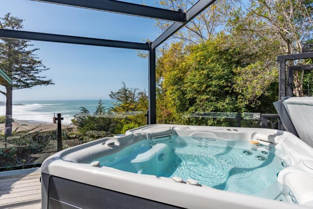 a jacuzzi tub with a view of the ocean at Eagle's Landing - Main House in Gualala