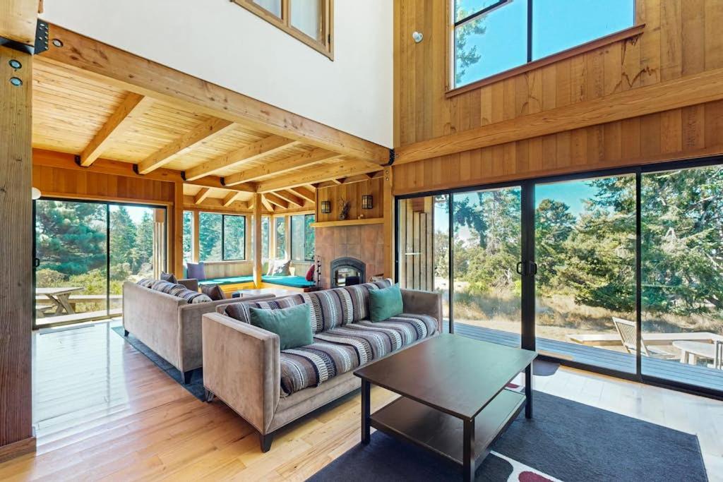 a living room with a couch and a table at Ocean Pines Lodge in Sea Ranch