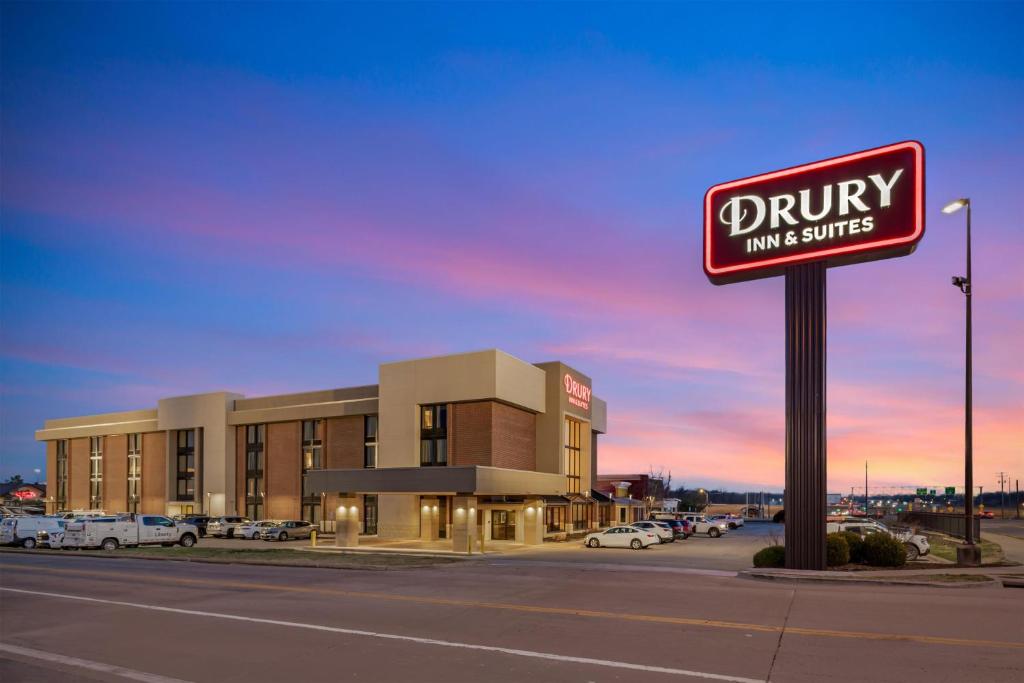 a sign for a drug store in a parking lot at Drury Inn & Suites Joplin in Joplin