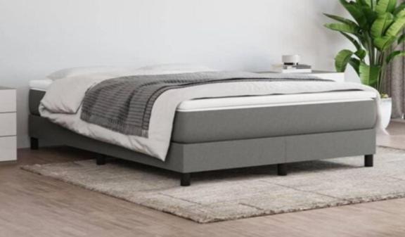 a bed in a white room with a bed frame at Luxury House Cascais in Cascais