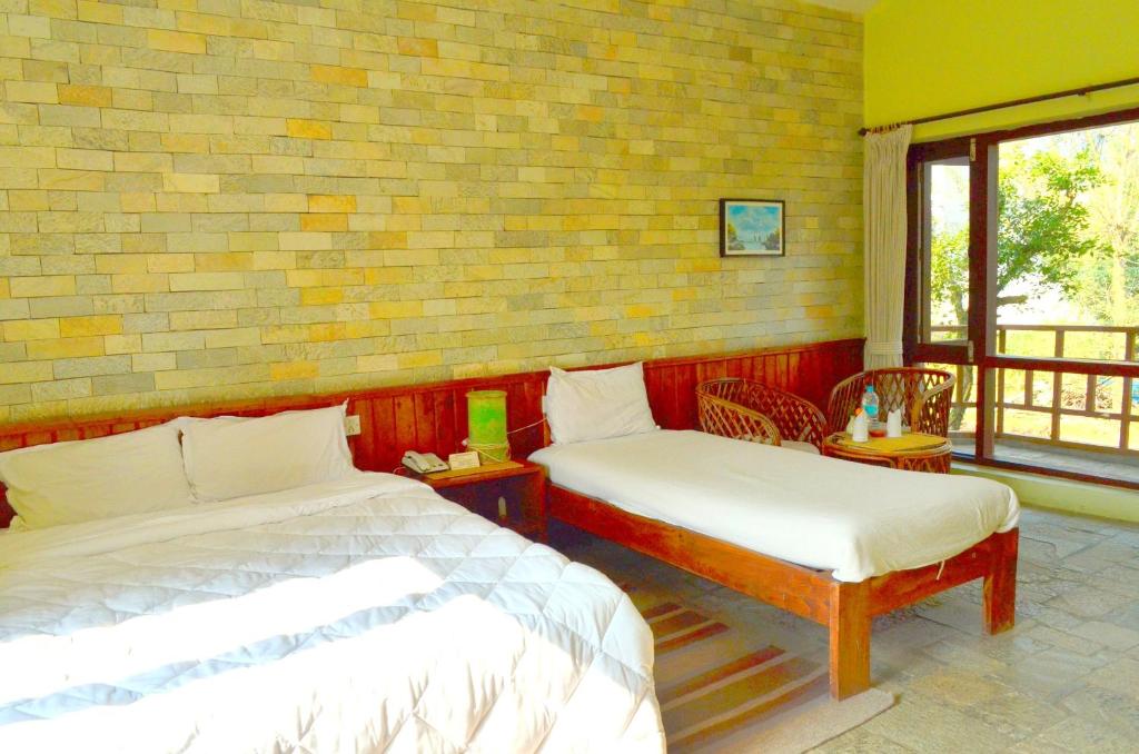 Letto o letti in una camera di Mum's Garden Resort