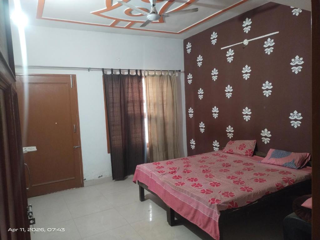 a bedroom with a bed with a red comforter at Guest house one room 9&&&&So&&2 in Kharar