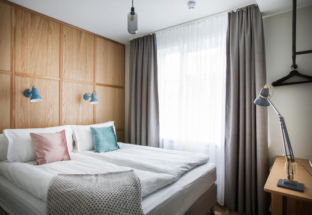 Ένα ή περισσότερα κρεβάτια σε δωμάτιο στο Ódinsvé Hotel Apartments