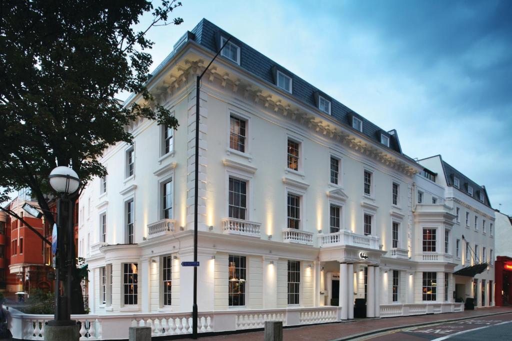 a large white building on a city street at Malmaison Reading in Reading