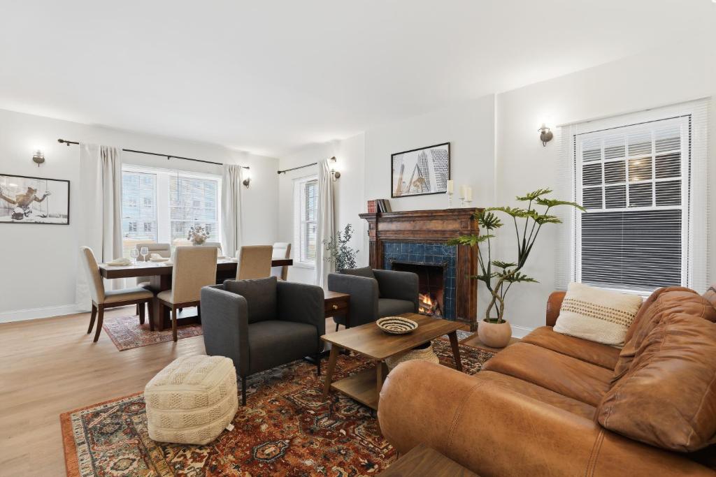 a living room with a couch and a fireplace at Walk to VA DMC 2BR 2 FULL Baths Midtown in Detroit