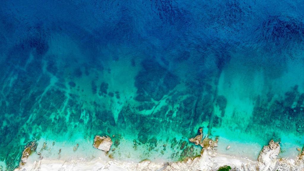 an aerial view of the ocean and a beach at Casa Mare in Rabac