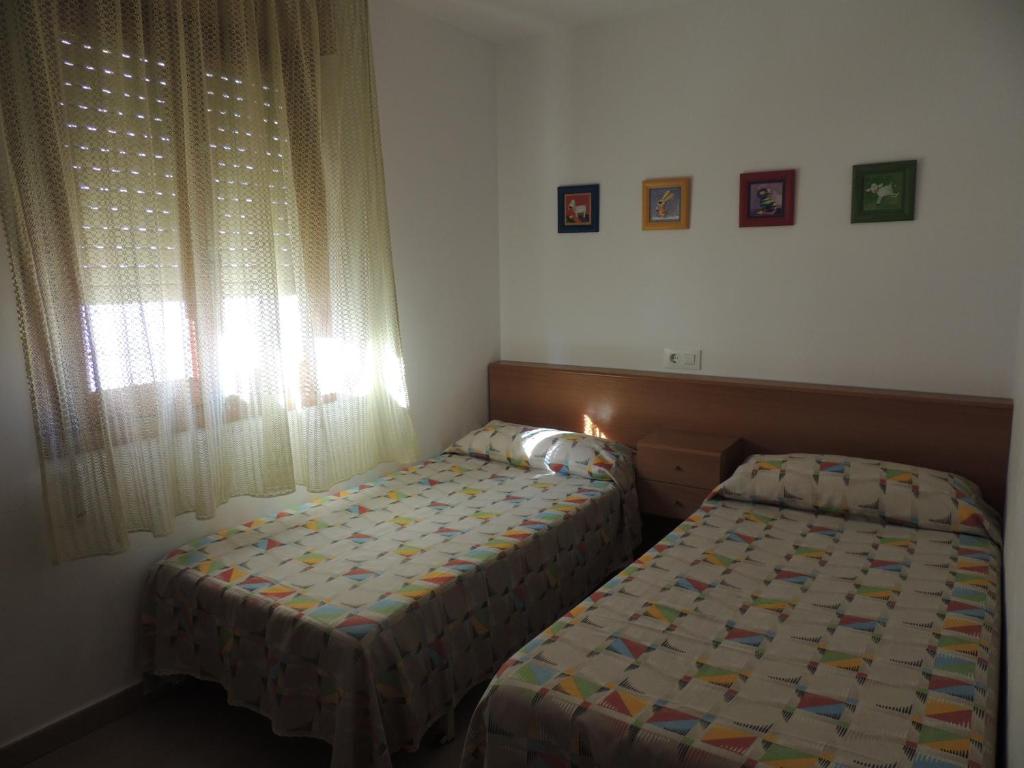 Postel nebo postele na pokoji v ubytování Apartamento Nuria Los Abanicos