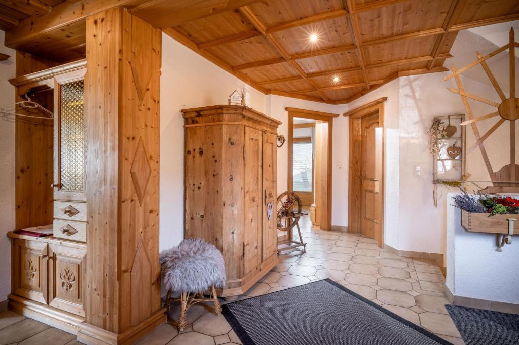 a large hallway with wooden walls and a wooden ceiling at Sophie's Haus in Fügen
