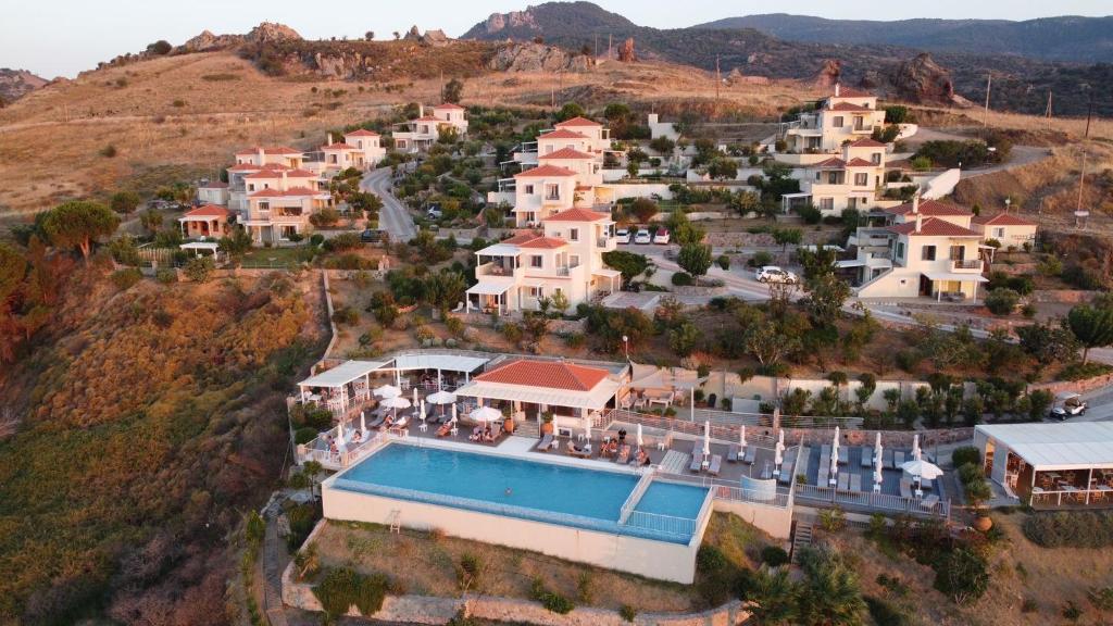 an aerial view of a house on a hill with a pool at Birds Bay Resort in Petra
