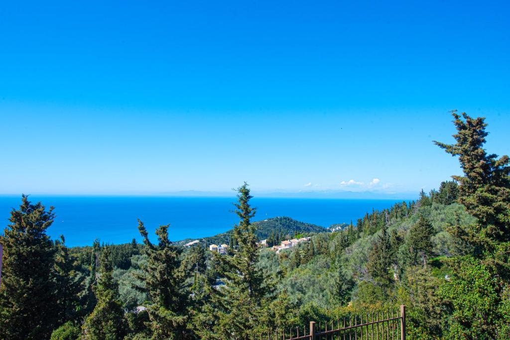 a view of the ocean from the top of a mountain at Scorpina Horizon Villa in Kalamitsi