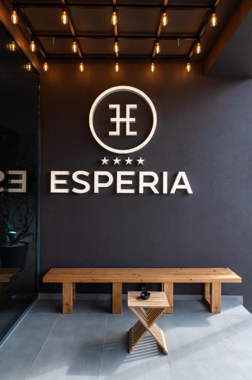 a wall with the espera logo on it at Esperia Hotel in Larisa