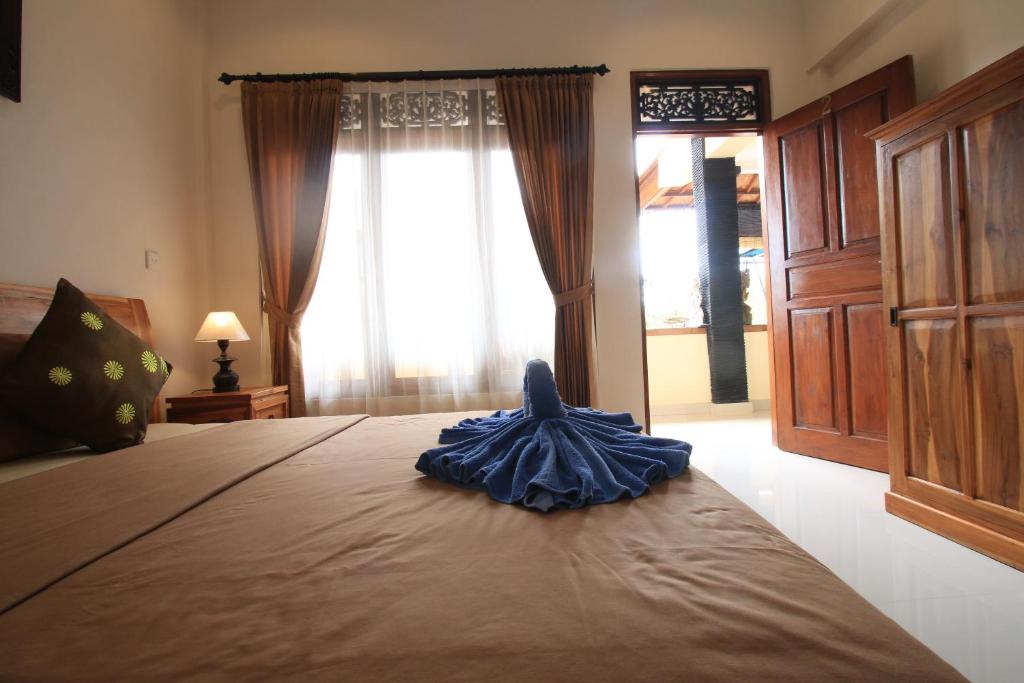 Postel nebo postele na pokoji v ubytování Baba Homestay