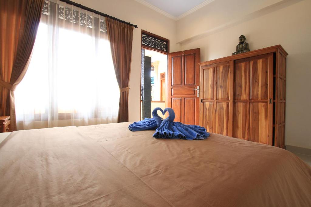 Postel nebo postele na pokoji v ubytování Baba Homestay