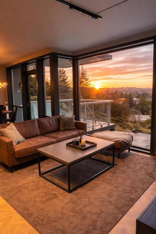 a living room with a couch and a table at Bergen Apartment with a view in Bergen