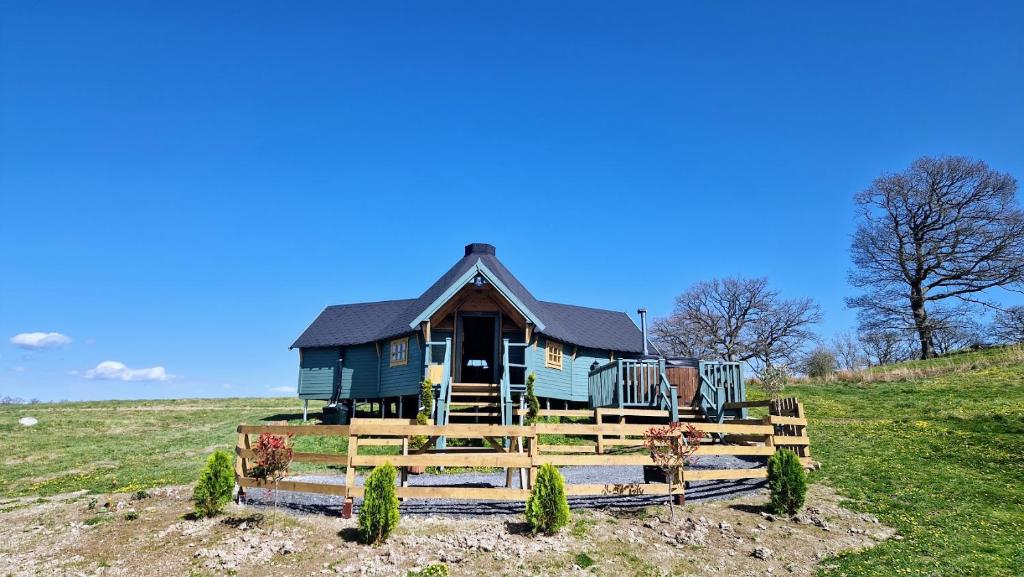 a small house on top of a hill at Oak Hill Escape in Welshpool