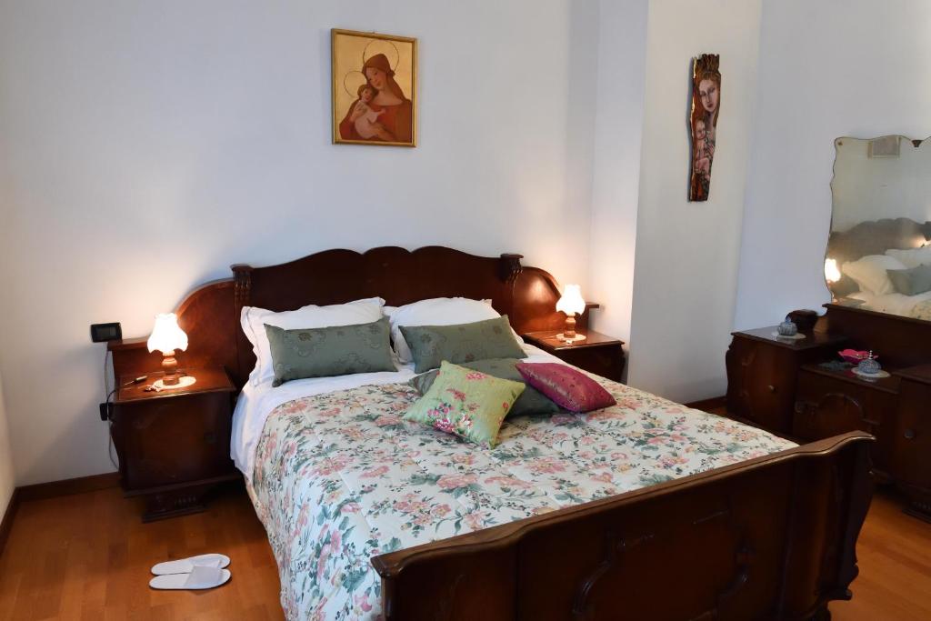 Łóżko lub łóżka w pokoju w obiekcie Agriturismo Memento