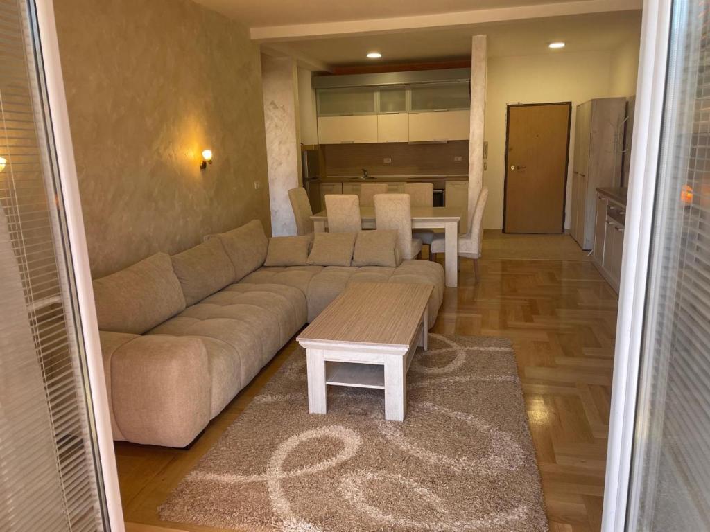a living room with a couch and a table at Teuta Apartment in Tivat in Župa