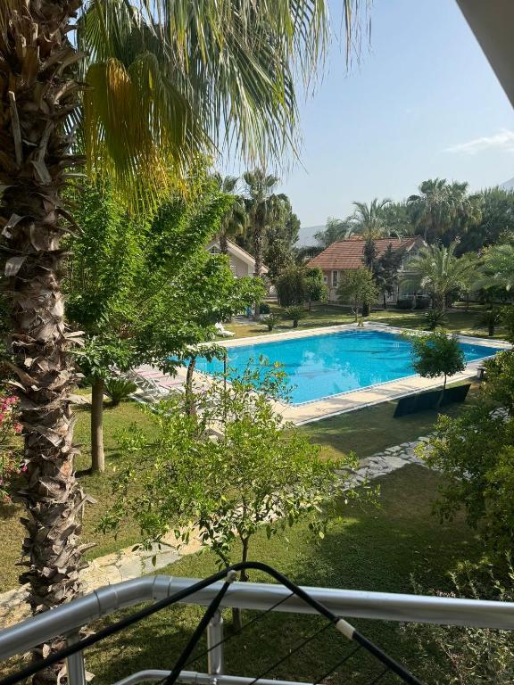 a view of the pool from the balcony of a resort at Amazonica MAGİC DREAM in Kemer